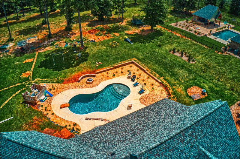 Poolside landscaping and patio area