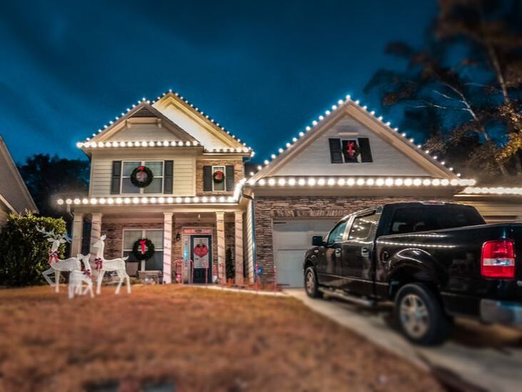White holiday lighting on a house in Kathleen, GA