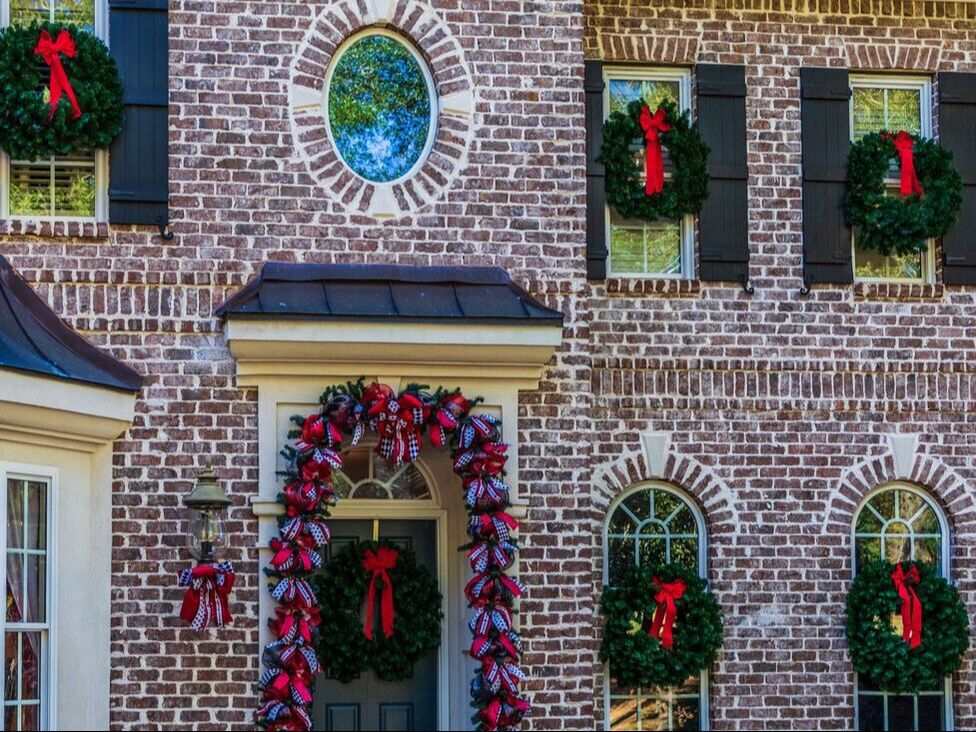 Unlit Christmas wreathes installed on a house in Bonaire, GA