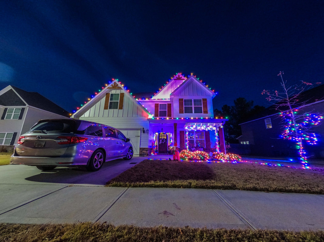 Multicolor Christmas lights installed on a house