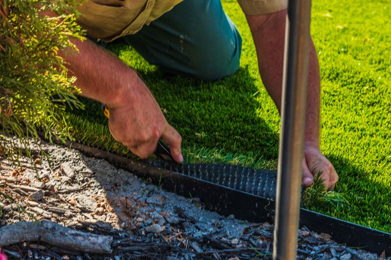 Installing artificial turf grass in Perry, Georgia