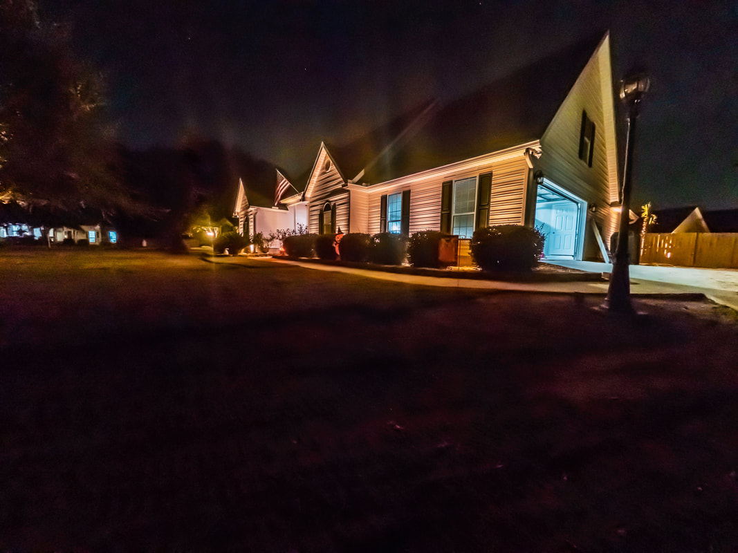 Landscape lighting on a house at night