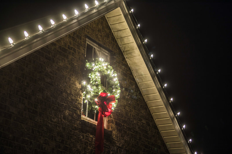 Wreath and lights on a house